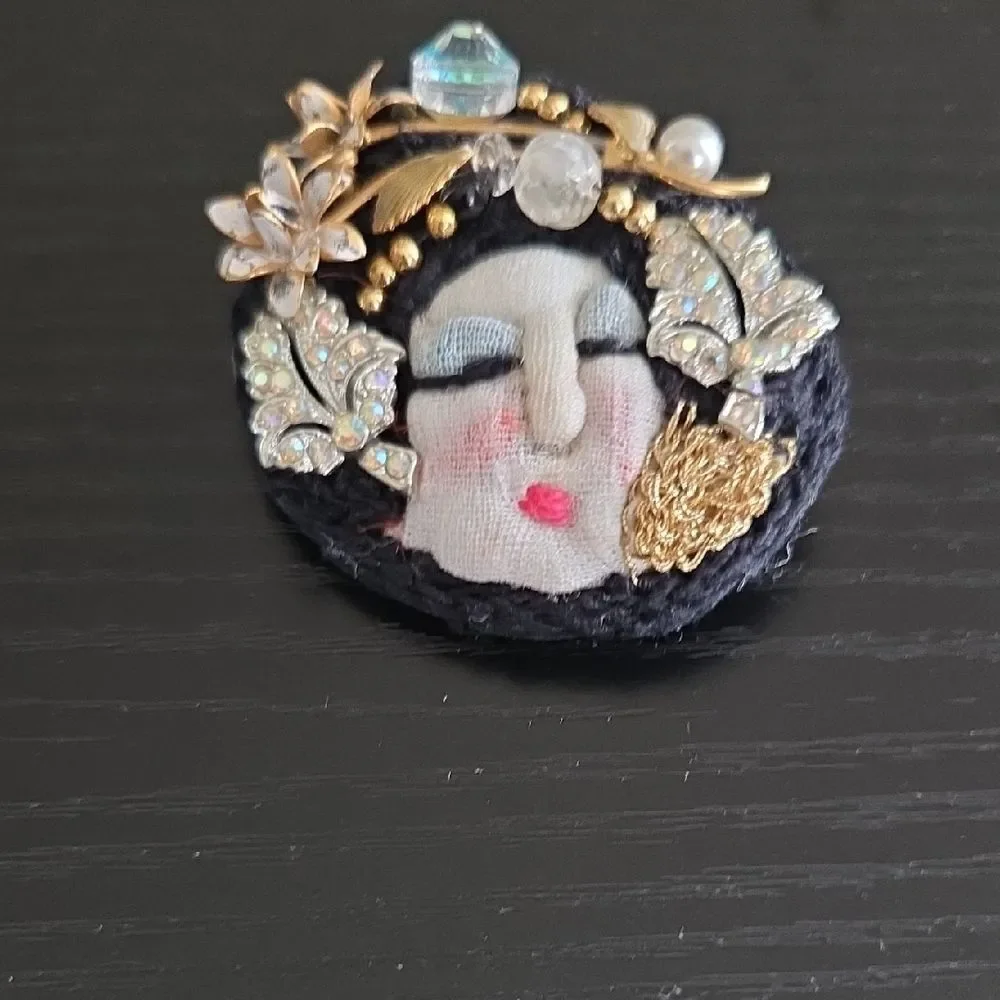 Artistic Face Brooch with Gold and Black Accents